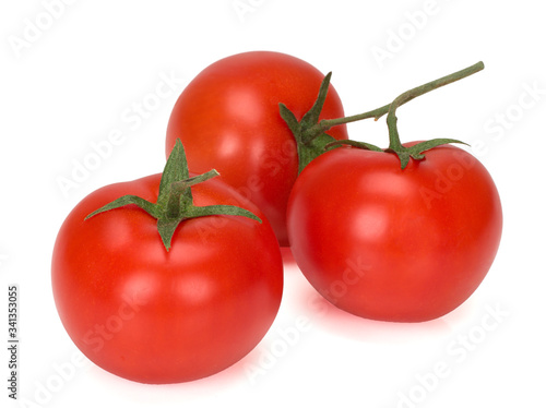 three tomatoes on a white background, close-up