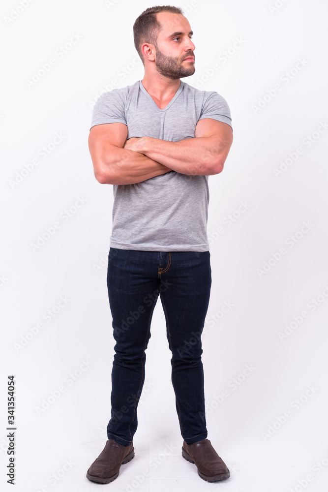 Full body shot of muscular bearded man Full body shot of muscular bearded man