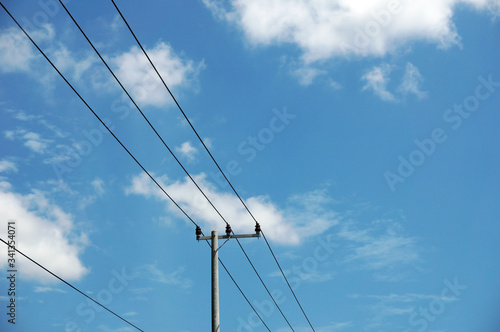 Wallpaper Mural Pylon of a power line with outgoing electric wires againts a cloud blue sky                                  Torontodigital.ca
