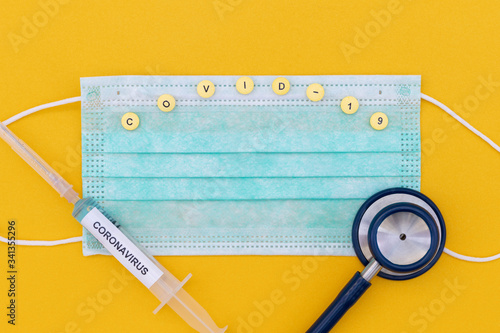 Coronavirus (COVID-19) testng concept, medical testing equipment on yellow background. photo