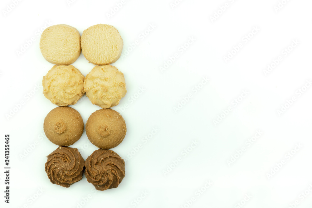 Premium butter cookies isolated on white background with copy space. Shallow depth of field. Premium butter cookies isolated on white background with copy space. Shallow depth of field.