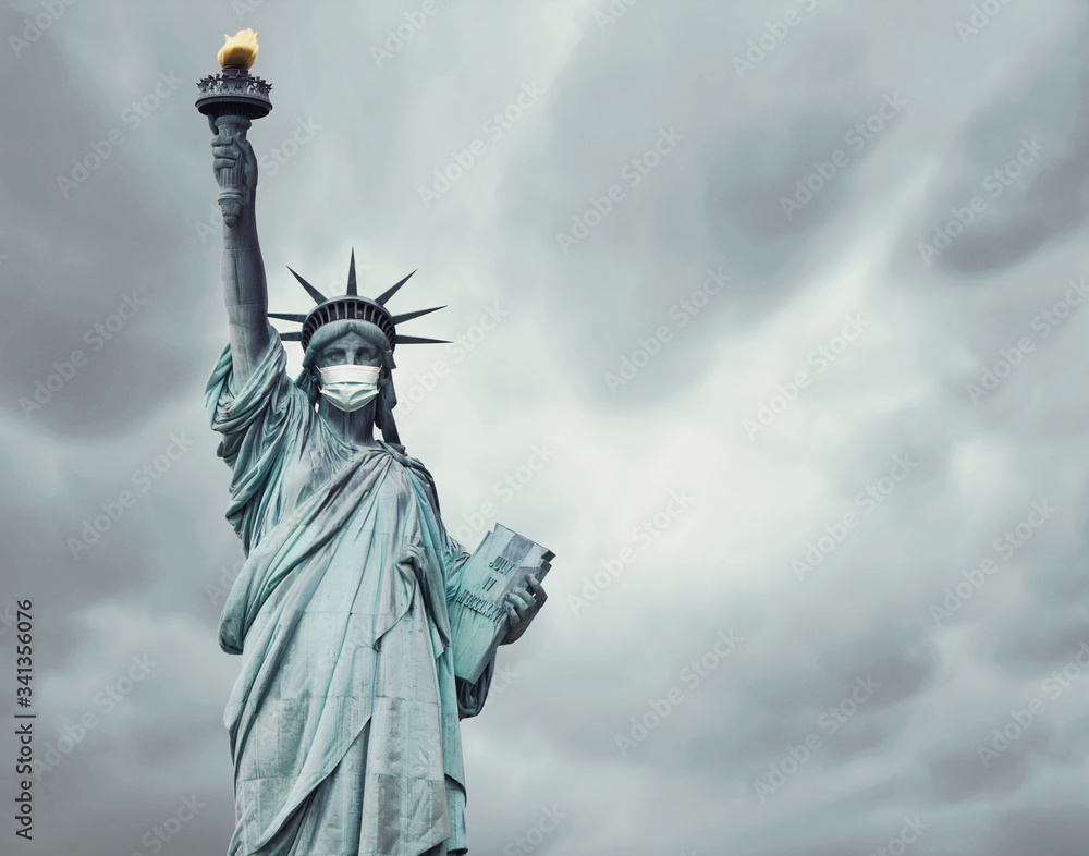 Fototapeta premium Stock photo of the New York's Statue of Liberty with a mask caused by the coronavirus and copy space