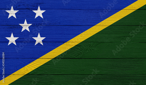 Solomon Islands flag on a wooden texture. Wood texture, planks Wooden texture background flag. Flag painted with paints on wood