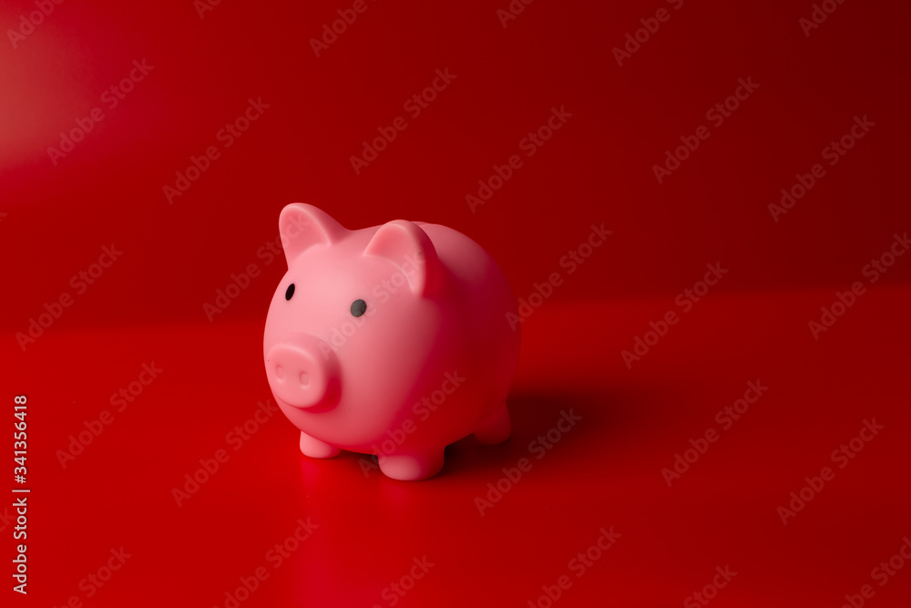 Piggy bank on red background Piggy bank on red background