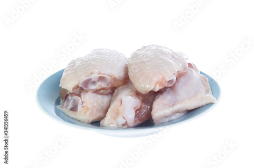 Raw chicken  on cutting board on white background