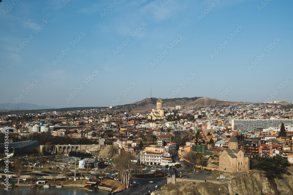 Panorama of the city of Tbilisi from a high point. Tiled roofs of old houses. View of the old city.