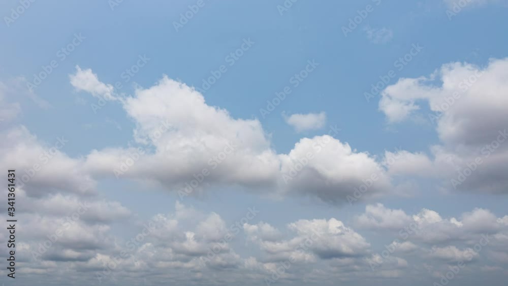 Puffy fluffy beautiful white clouds on blue sky.B roll footage cloudscape timelapse cloudy. 4K UHD. Puffy fluffy beautiful white clouds on blue sky.B roll footage cloudscape timelapse cloudy. 4K UHD.