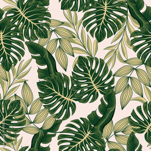 Fashionable seamless tropical pattern with bright plants and leaves on a pastel background. Beautiful seamless vector floral pattern. Exotic jungle wallpaper.