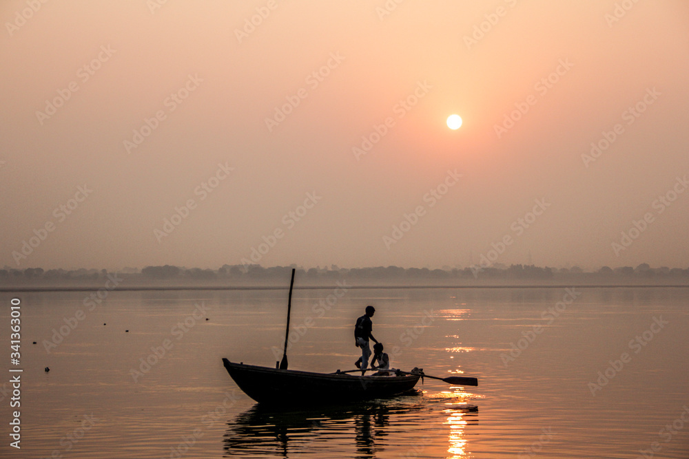fishermen at a sunrise