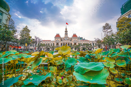 Cityscape view of HoChiMinh City People's Committee and Nguyen Hue Walking Street , Vietnam with blue sky at sunset.
