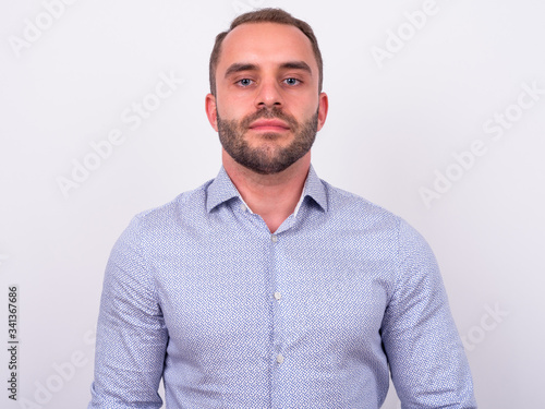 Portrait of bearded businessman looking at camera © Ranta Images