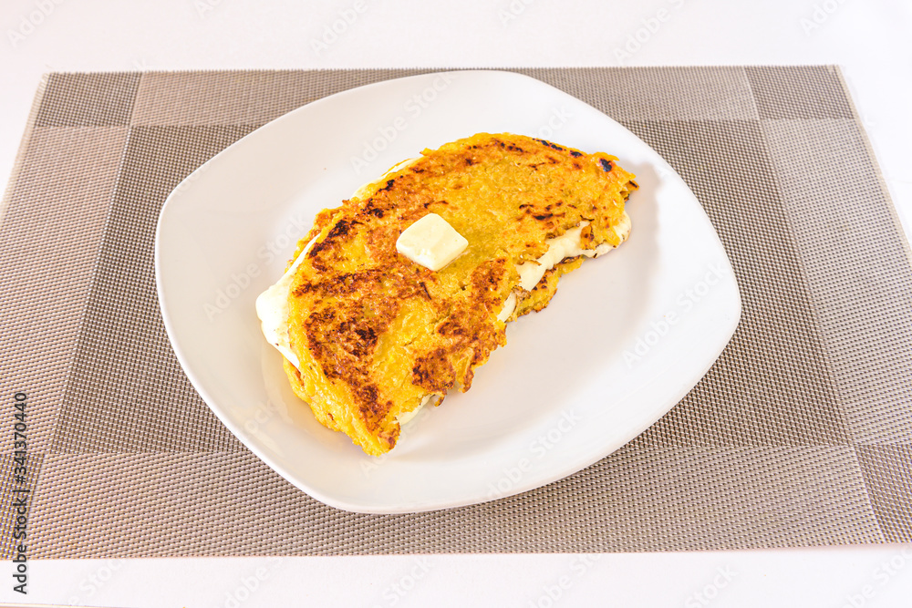 Venezuelan cachapa with cheese and butter Venezuelan cachapa with cheese and butter