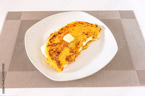 Venezuelan cachapa with cheese and butter