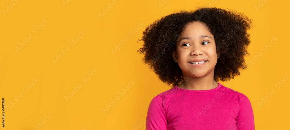 Portrait of lovely african american kid, little girl over yellow background - obrazy, fototapety, plakaty 