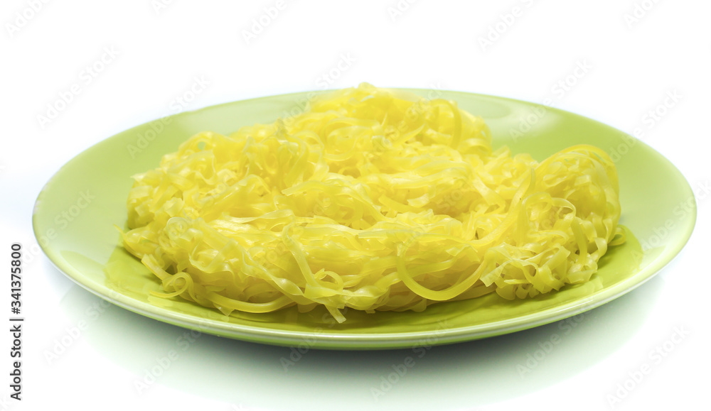 yellow noodles on dish isolated on white background yellow noodles on dish isolated on white background