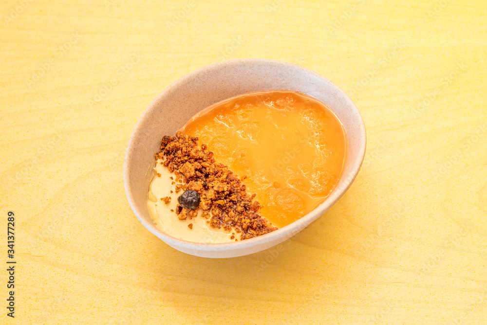 bowl of curd with cheesecake and biscuit sand bowl of curd with cheesecake and biscuit sand