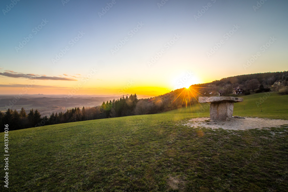 sunset over the stone altar with a beautiful view to the spring scenery