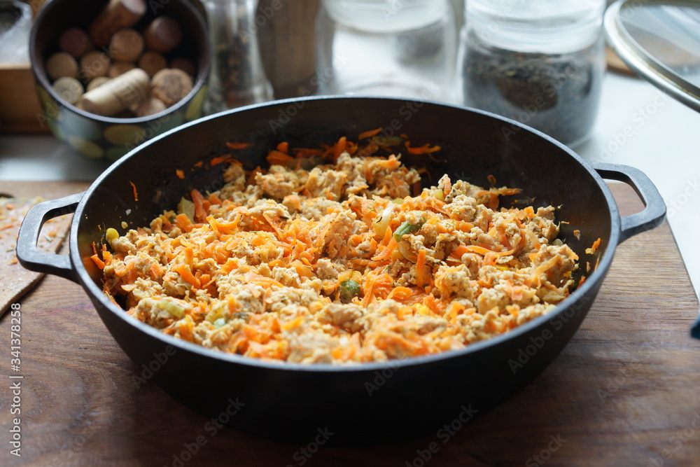 Cooking at home kitchen chicken meat side dish. Cook fry minced meat with vegetables. Cooking at home kitchen chicken meat side dish. Cook fry minced meat with vegetables.