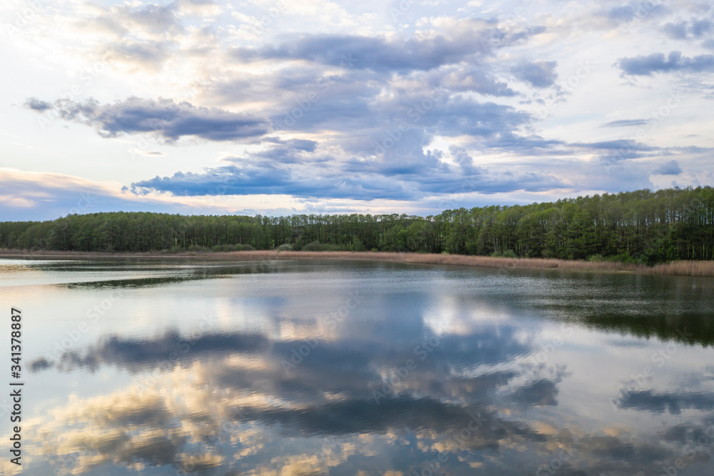 Germany,?Brandenburg, Clouds reflecting in shiny lake Germany,?Brandenburg, Clouds reflecting in shiny lake