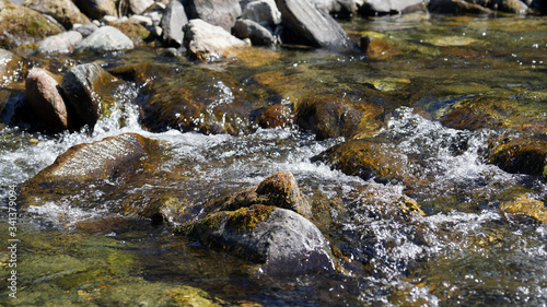 a mountain creek in spring with clear melt water