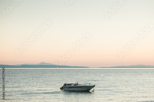 Boat in the sea in beautiful sunset © marjan4782