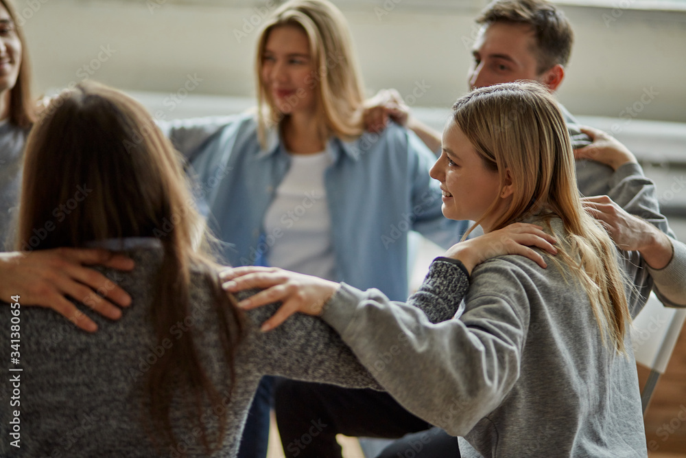 custom made wallpaper toronto digitalyoung caucasian people taking part in a meeting of a support group, people hug and support each other, alcohol addicts