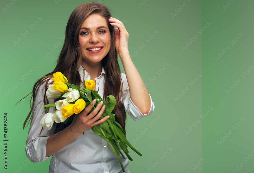 woman holding tulips flowers isolated portrait over green background. woman holding tulips flowers isolated portrait over green background.