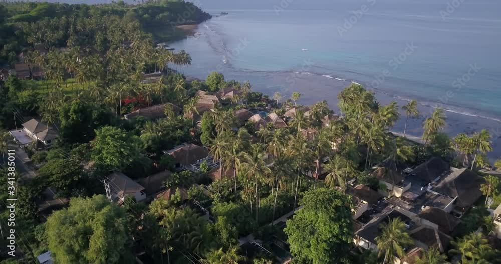 Drone shot in mountain above jungle and resorts near the ocean Drone shot in mountain above jungle and resorts near the ocean