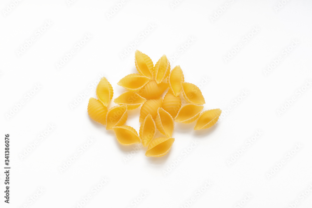 conchiglie rigate pasta pieces isolated on white conchiglie rigate pasta pieces isolated on white