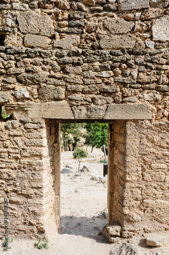 Fototapeta Naklejka Na Ścianę i Meble -  Door in a wall at Capdepera Castle, Mallorca/Majorca