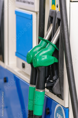 Nozzles on a petrol pump photo