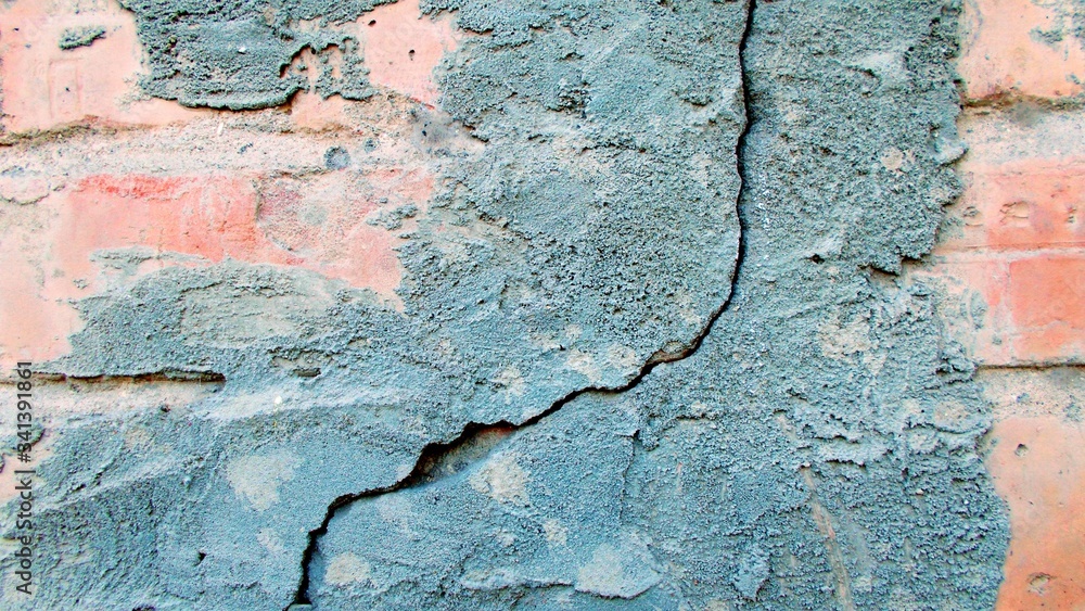 Crack in the wall of the building. Blurred defocused background for web design.
Crack in the wall of the building. Blurred defocused background for web design.