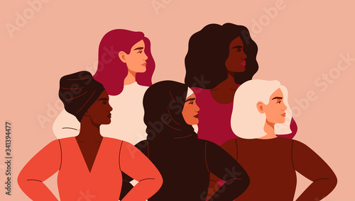Five women of different nationalities and cultures standing together. Friendship poster, the union of feminists or sisterhood. The concept of gender equality and of the female empowerment movement. photo