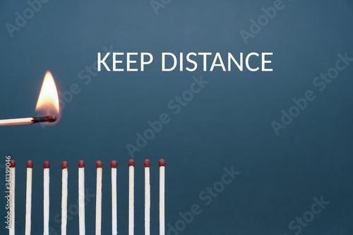 Maintain a distance between you and other people. Social distancing concept using burnt out match sticks as a metaphor for containing coronavirus or any virus or pandemic outbreak. Stay at home