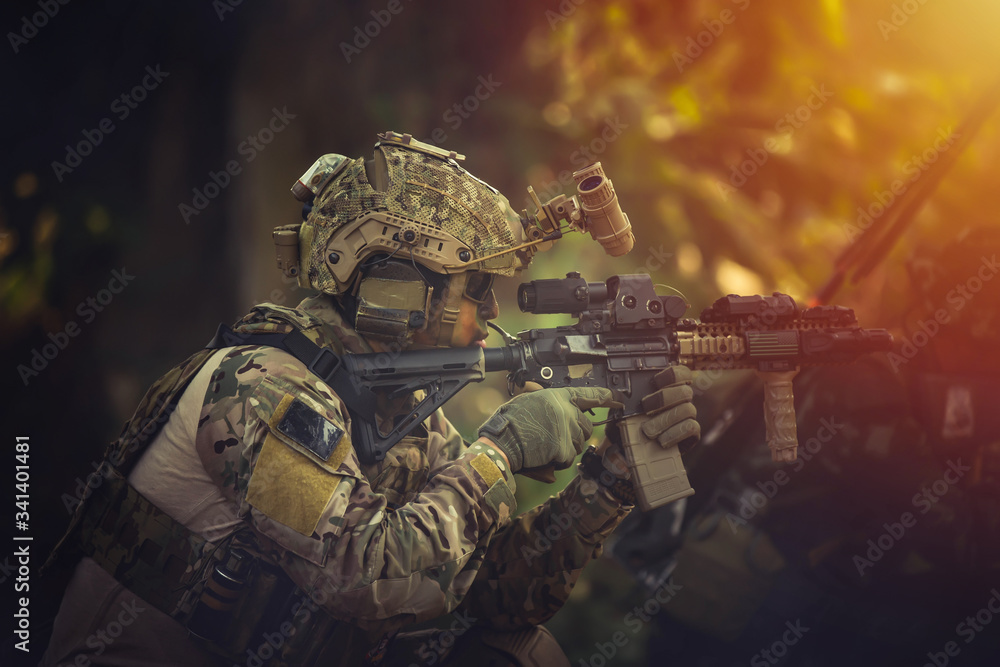 Special forces. soldier assault rifle with silencer. sniper in the ...
