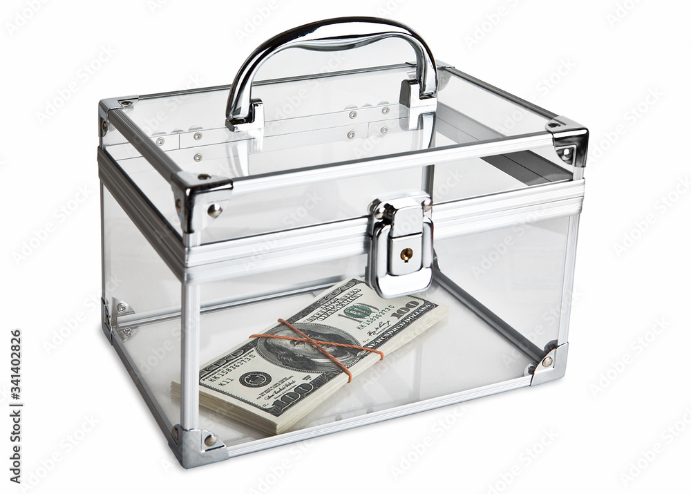 A small bundle of dollars, tied with an elastic band, lies in a closed transparent case. Isolated on a white background. A small bundle of dollars, tied with an elastic band, lies in a closed transparent case. Isolated on a white background.
