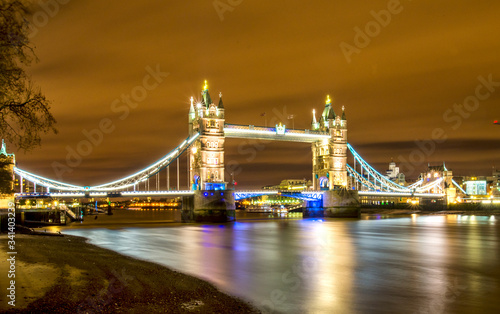 Tower Bridge at night illuminated by floodlights. Famous Tower Bridge in the evening  London  England. 