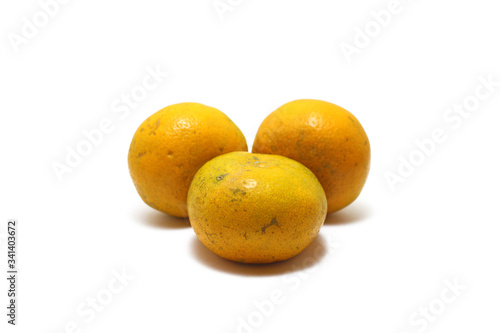Three sweet oranges (Citrus sinensis) isolated on white background, perfect for breakfasting during ramadan