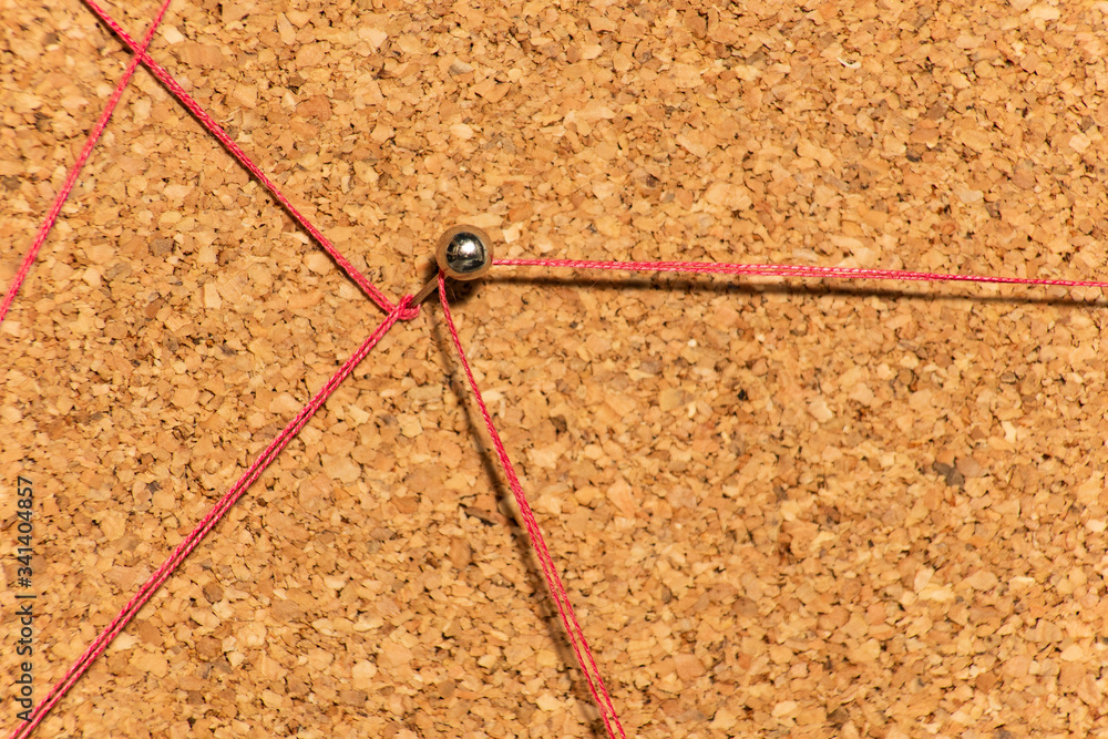 Red threads lead to a metal pin Red threads lead to a metal pin