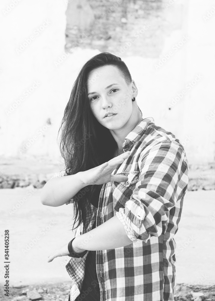 Girl dancing hiphop in old industrial building. Young girl art dance