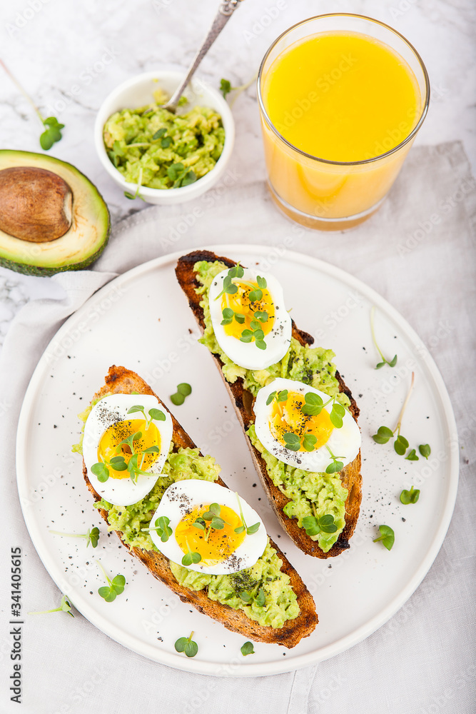 Avocado Sandwich with Egg and Micro green. Healthy breakfast concept