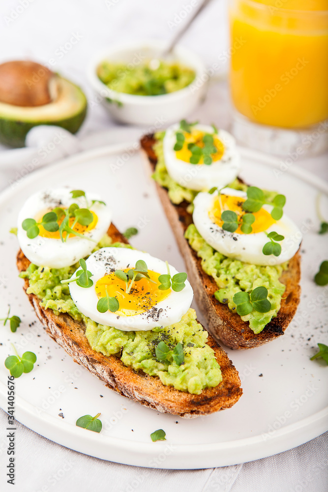 Avocado Sandwich with Egg and Micro green. Healthy breakfast concept