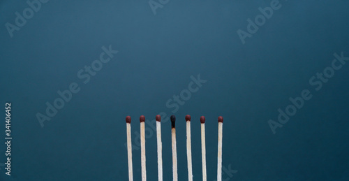 Maintain a distance between you and other people. Social distancing concept using burnt out match sticks as a metaphor for containing coronavirus or any virus or pandemic outbreak. Stay at home