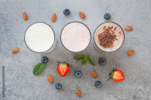 Assorted protein cocktails with fresh fruits, berries and chocolate. Protein shake. Sports nutrition and healthy lifestyle concept. Top view.
