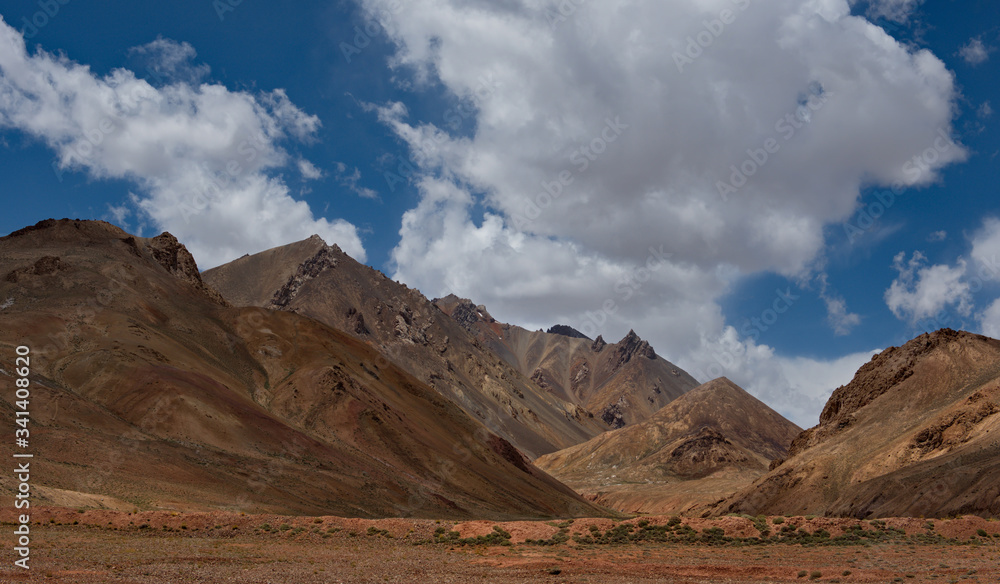 Fototapeta premium Tajikistan, the Picturesque Tien Shan mountains around the Alichur river valley along the Pamir highway. Inaccessible mountains of the Tien Shan