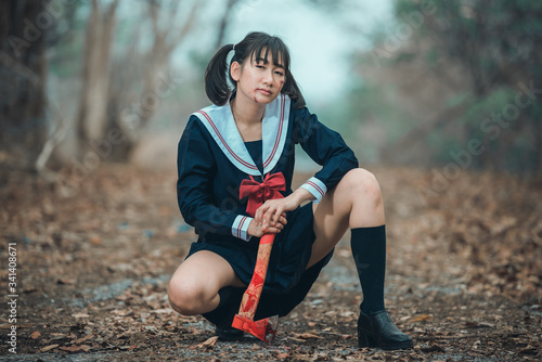 Portrait of asian murderer in student uniform photo