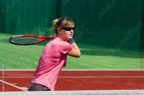 Female tennis player preparing to hit