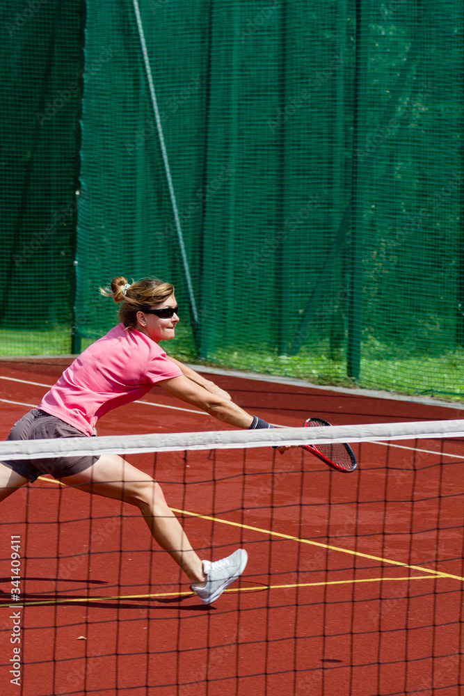 Female tennis player hitting a volley