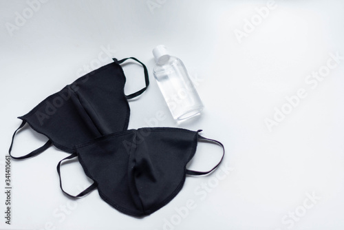 black mask and antiseptic gel
