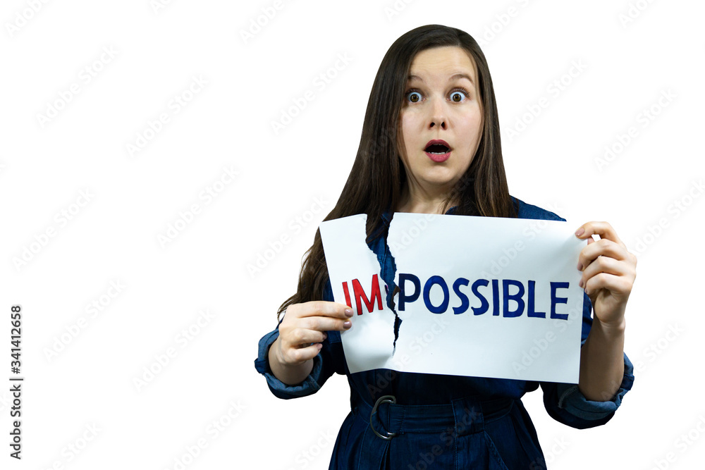 positivity concept, woman tearing word impossible to make possible positivity concept, woman tearing word impossible to make possible